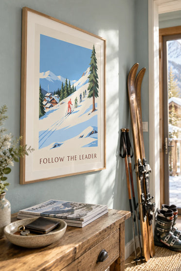 Poster of a ski instructor in red and his young students: framed on a wall